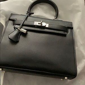 Black top handle handbag